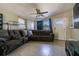 Living room with tile flooring and sectional sofa at 9696 Groveland St, Seminole, FL 33772