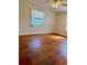 Cozy bedroom with bright natural light, featuring sleek hardwood floors at 1000 Country Club N Rd, St Petersburg, FL 33710