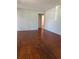 Bright living room with hardwood floors and a fresh coat of paint at 1000 Country Club N Rd, St Petersburg, FL 33710