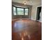 Light-filled living area featuring a large bay window and classic details at 1000 Country Club N Rd, St Petersburg, FL 33710