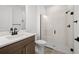 Contemporary bathroom with vanity, modern fixtures, and glass-enclosed shower at 17925 Nadine Pl, Nokomis, FL 34275