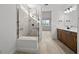 Bright bathroom showcases a tiled shower with glass enclosure at 17925 Nadine Pl, Nokomis, FL 34275