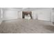 Open-concept living room leads to modern kitchen with stainless steel appliances at 17925 Nadine Pl, Nokomis, FL 34275