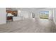 Expansive open-concept living space showcasing kitchen, dining, and living areas with access to the lanai at 17925 Nadine Pl, Nokomis, FL 34275