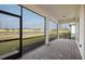Enjoy outdoor living in the screened patio overlooking a serene water view and lush landscaping at 17925 Nadine Pl, Nokomis, FL 34275