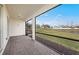 Relax on the screened patio, which offers views of the pond, landscaping, and blue skies at 17925 Nadine Pl, Nokomis, FL 34275