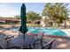 Inviting community pool with lounge chairs and patio tables at 3207 Green Dolphin St, Tarpon Springs, FL 34689