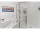 Bathroom with a shower/tub combo and tile surround at 33975 Astoria Cir, Wesley Chapel, FL 33545