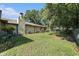 Large grassy backyard with mature trees at 5105 N 45Th St, Tampa, FL 33610
