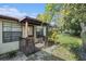 Small backyard with grass and wooden deck at 5105 N 45Th St, Tampa, FL 33610