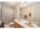 Bathroom with double vanity, shower, and tiled walls at 5105 N 45Th St, Tampa, FL 33610
