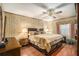 Bedroom with queen-size bed and wood floors at 5105 N 45Th St, Tampa, FL 33610