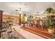 Open dining area with raised platform, chandelier, and adjacent seating area at 5105 N 45Th St, Tampa, FL 33610