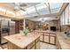 Island kitchen features granite countertops and breakfast bar at 5105 N 45Th St, Tampa, FL 33610