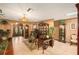 Spacious living room featuring hardwood floors, a decorative fireplace, and ample natural light at 5105 N 45Th St, Tampa, FL 33610