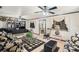 Living room features floral sofas, a chessboard rug, and a ceiling fan at 5105 N 45Th St, Tampa, FL 33610