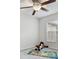 bedroom with window and ceiling fan at 7916 Longwood Run Ln, Tampa, FL 33615