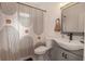 Stylish bathroom features sleek sink, modern fixtures and a patterned shower curtain at 8903 N Edison Ave, Tampa, FL 33604