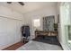 Bedroom with wood floors, white walls, and a large window for ample natural light at 8903 N Edison Ave, Tampa, FL 33604