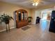 Kitchen dining area with tile floor and hutch at 10863 112Th Pl, Largo, FL 33778