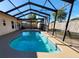 Relaxing kidney-shaped pool with a screened enclosure at 10863 112Th Pl, Largo, FL 33778