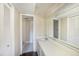 Bright bathroom featuring tiled shower/tub, modern vanity with storage, and closet space at 141 Lakeview Way, Oldsmar, FL 34677