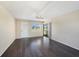 Bedroom featuring wood floors, ceiling fan, and sliding doors with lake views at 141 Lakeview Way, Oldsmar, FL 34677