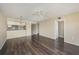 Living area with dark wood floors, ceiling fan, and dining space at 141 Lakeview Way, Oldsmar, FL 34677