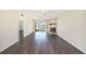 Living room with fireplace, sliding glass door, and adjacent kitchen at 141 Lakeview Way, Oldsmar, FL 34677