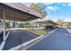 Covered parking area and nicely landscaped exterior of the homes at 141 Lakeview Way, Oldsmar, FL 34677
