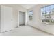 Bright bedroom with neutral carpet and ample closet space at 2345 Lake Woodberry Cir, Brandon, FL 33510