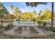 Community pool with lounge chairs and surrounding landscaping at 2345 Lake Woodberry Cir, Brandon, FL 33510