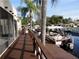 Private dock featuring deck railing and waterfront views at 2595 Cyprus Dr # 4-202, Palm Harbor, FL 34684