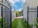 Private backyard with artificial turf and a pergola-covered patio at 3512 W Granada St, Tampa, FL 33629