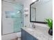 Updated bathroom with a walk-in shower and modern vanity at 3512 W Granada St, Tampa, FL 33629