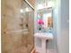 Bathroom with pedestal sink and glass shower at 3512 W Granada St, Tampa, FL 33629