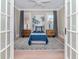 Guest bedroom with light blue bedding and wood accents at 3512 W Granada St, Tampa, FL 33629