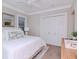 Bedroom with a king-size bed and white shutters at 3512 W Granada St, Tampa, FL 33629