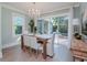 Bright dining room with sliding glass doors leading to a patio and pool at 3512 W Granada St, Tampa, FL 33629