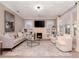 Bright living room with fireplace, built-ins, and hardwood floors at 3512 W Granada St, Tampa, FL 33629