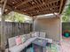 Relaxing patio area with a pergola, seating, and fire pit at 3512 W Granada St, Tampa, FL 33629