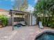 Backyard oasis with a pool, pergola, and storage shed at 3512 W Granada St, Tampa, FL 33629
