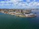 Wide aerial view of a waterfront home and neighborhood at 485 41St Ave, St Pete Beach, FL 33706
