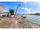 Brick pathway leading to waterfront, offering serene views at 485 41St Ave, St Pete Beach, FL 33706