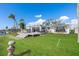 House with a large grassy backyard and wooden deck at 485 41St Ave, St Pete Beach, FL 33706