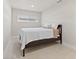 Cozy bedroom with a full-size bed and window at 485 41St Ave, St Pete Beach, FL 33706