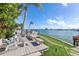 Spacious deck overlooking the water with seating and dining areas at 485 41St Ave, St Pete Beach, FL 33706