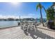 Large waterfront deck with seating area at 485 41St Ave, St Pete Beach, FL 33706