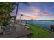 Spacious waterfront deck with seating, enjoying sunset views at 485 41St Ave, St Pete Beach, FL 33706