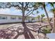 Updated single story home with brick paver driveway, lush landscaping, and mature trees at 485 41St Ave, St Pete Beach, FL 33706
